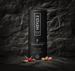 Chili orange flavored pistachios in a black and white package with a bold design. The pistachios are accompanied by red chili peppers, indicating a spicy and flavorful snack.