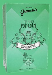 Boxes of caramel popcorn coated with Matcha green tea, 100g. Popcorn snack with sweet caramel and earthy matcha flavors.
