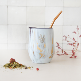 Marble and gold effect isothermal calabash with bombilla, a traditional South American drinking vessel for yerba mate tea.