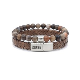  Black leather men's bracelet with woven texture and black metal closure.