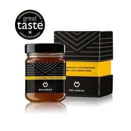 Greek honey from wild herbs and thyme, packaged in a luxury gift set. Rich, aromatic flavor with a smooth texture.