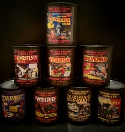 Vintage-style Halloween-themed scented candles in various spooky designs and fragrances, including "Creepy", "Weird", and "Daring".