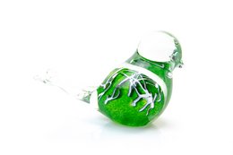 Decorative green glass bird statue with white stripes and intricate detailing.