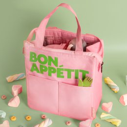  A pink insulated lunch bag with the text "BON APPETIT" printed in green on the front. The bag has a zipper closure and appears to be made of a durable, water-resistant material.