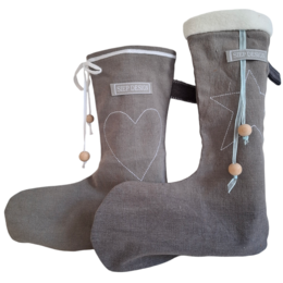 Gray felt Christmas stocking with white button and ribbon detail.