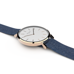 Elegant rose gold watch with a navy blue leather strap.