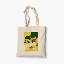 Organic tote bag with a vibrant floral design featuring yellow and green flowers on a dark background. The bag has a sturdy canvas construction and comfortable cotton handles.