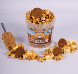 Two delicious stroopwafel snacks in a container. The stroopwafels are made with caramel filling between two waffle-like cookies.