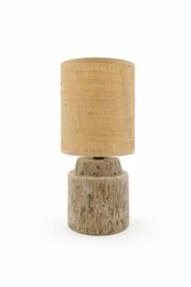 Stoneware table lamp with chic patina finish, featuring a cylindrical lamp base and a neutral-toned fabric shade.