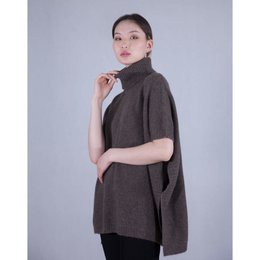  Cozy brown poncho with a high collar, perfect for layering over tops and dresses.