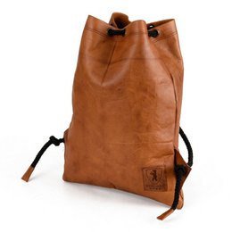  Vintage brown leather gym bag with adjustable straps and drawstring closure.