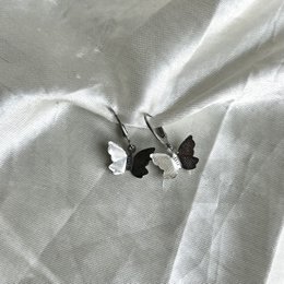 Silver butterfly-shaped earrings with a simple, elegant design.