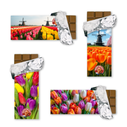 Adjustable braided bracelet in green, grey, and turquoise colors with metal clasp.