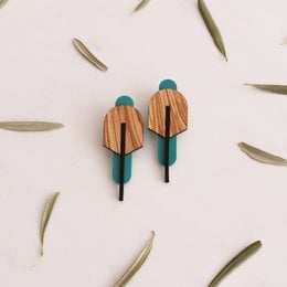 Cellulose acetate statement earrings in Rosa-Verde, Madera-Verde, and Madera-Rutenio colors. Geometric, angular design with wooden and metal accents.