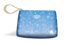 A small, rectangular clutch pouch with a blue and white winter scene design featuring the Eiffel Tower and snowflakes. The pouch has a zipper closure and a fabric loop handle.