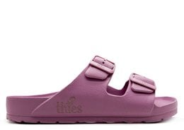 Vegan sandal in a light purple color, featuring two adjustable buckle straps for a comfortable fit. The sandal has a flat, EVA foam sole for lightweight cushioning.