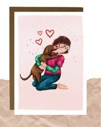 A postcard featuring a loving embrace between two people, with hearts surrounding them, conveying a romantic and affectionate sentiment.