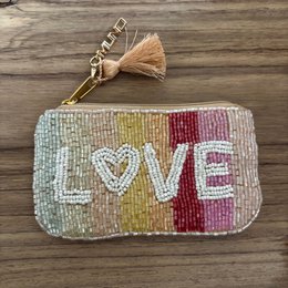 Handcrafted beaded heart-shaped pouch in a vibrant multicolored design, perfect as a gift.