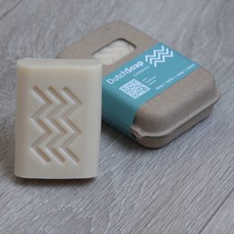 Tropical island-inspired coconut soap bar with a chevron pattern design, made with natural ingredients.