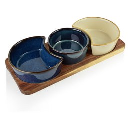  Modern wooden serving board with three ceramic bowls, navy blue and cream colored, contemporary kitchen set.