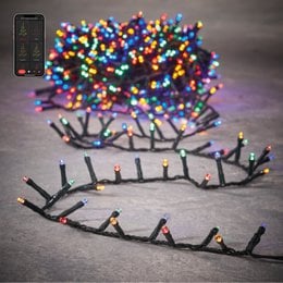 Multicolor LED Christmas tree lighting with 1500 lights, 3000 cm long, snake-like design.