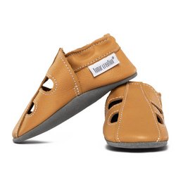  Leather summer slippers in a savanna color. Features a simple, minimalist design with a comfortable fit. Suitable for casual wear.