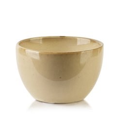 Small, round, ceramic bowl in a neutral beige color.