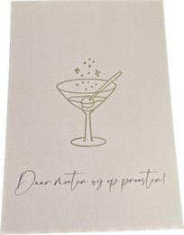 A gold foil greeting card with a celebratory cocktail glass illustration and the text "Dear friend, we've got to toast to that!"