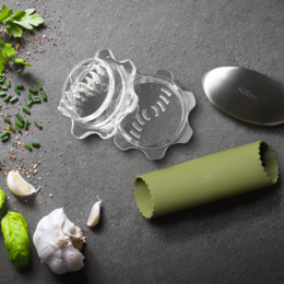 A green vegetable peeler with a twisted design, suitable for peeling a variety of fruits and vegetables.