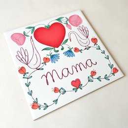  Decorative tile with a large, pink rose-like flower and green leaves. The tile has a simple, geometric design style.