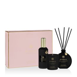  Luxurious reed diffuser set with notes of oud and bergamot, featuring a sleek black glass bottle and decorative reeds.