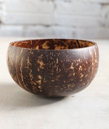 Large, smooth, natural coconut bowl with a rustic, textured exterior.