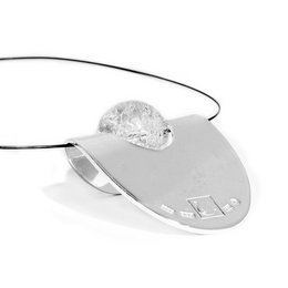 The ICE Doubled Pendant is a pendant made of silver-colored metal with a round, smooth, and shiny pendant. The pendant appears to have a textured or hammered surface, giving it a unique and artisanal look. The pendant is suspended from a thin, black cord or chain.