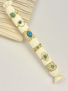 Set of 6 golden turquoise stone rings in stainless steel with cushion offered