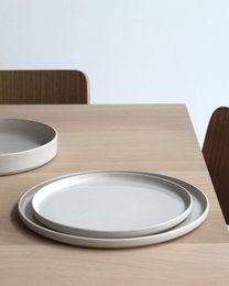  "Small round dinner plate, sand color, minimalist design, flat shape, modern tableware"