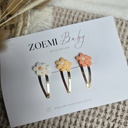  Pink and gold hair clips with floral designs. Suitable for kids.