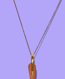 A golden chain necklace with a pendant.