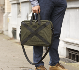 Durable olive green laptop bag with adjustable shoulder strap for comfortable carrying.