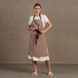  Linen adjustable apron in faded rose, pure black, pure white, stone green, and storm blue colors. Made of linen material with a simple, minimalist style.