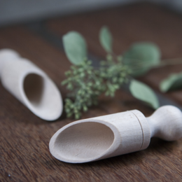 Wooden scoop for sugar, featuring a natural, organic design with a smooth, rounded shape and a light, natural wood color.