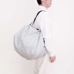 A large, foldable shopping bag in a striped pattern. The bag is made of a lightweight, durable material and features a compact, collapsible design for easy storage.