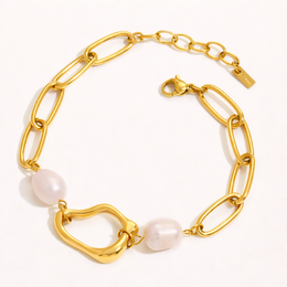  Gold-toned bracelet with oval-shaped links and white beads, suitable for casual or formal wear.