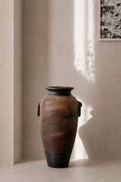  Terracotta vase, tall cylindrical shape, brown earthy tones, rustic ceramic vessel with dark rim