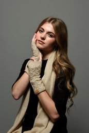 Beige cashmere fingerless gloves with a cable knit pattern. Available in multiple neutral colors including camel, grey, navy blue, and taupe.
