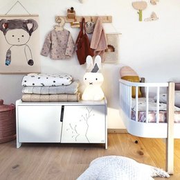 A white and cocoa-colored nightstand with a modern, minimalist design. Features a clean, rectangular shape and a combination of white and natural wood tones.