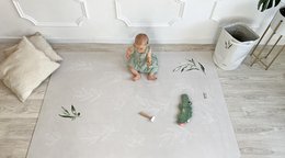 Large olive green rubber mat with leaf pattern, suitable for indoor play area or nursery.