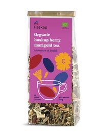 Organic haskap berry marigold tea with a blend of haskap berries, marigold flowers, and other natural ingredients. Vibrant purple and yellow colors. Herbal tea with a sweet, fruity flavor.