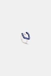 Silver blue pearl flower ring, curved stackable design with floral shape and elegant metallic finish.
