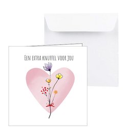 A greeting card featuring a pink heart and wild flowers, perfect for expressing love and affection.