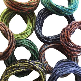 Knitted chain "SloWool" in various color combinations including green/natural, honey/medium blue, green/honey, anthracite/violet, anthracite/gray, yellow-green/teal, blue/yellow, anthracite/honey, yellow-green/red, brown/honey, yellow/yellow-green, anthracite/yellow, blue/teal, blue/red, blue-teal/teal, yellow/green, yellow/teal, yellow-green/honey, gray/green, gray/red, green/teal, green/red, honey/natural.
